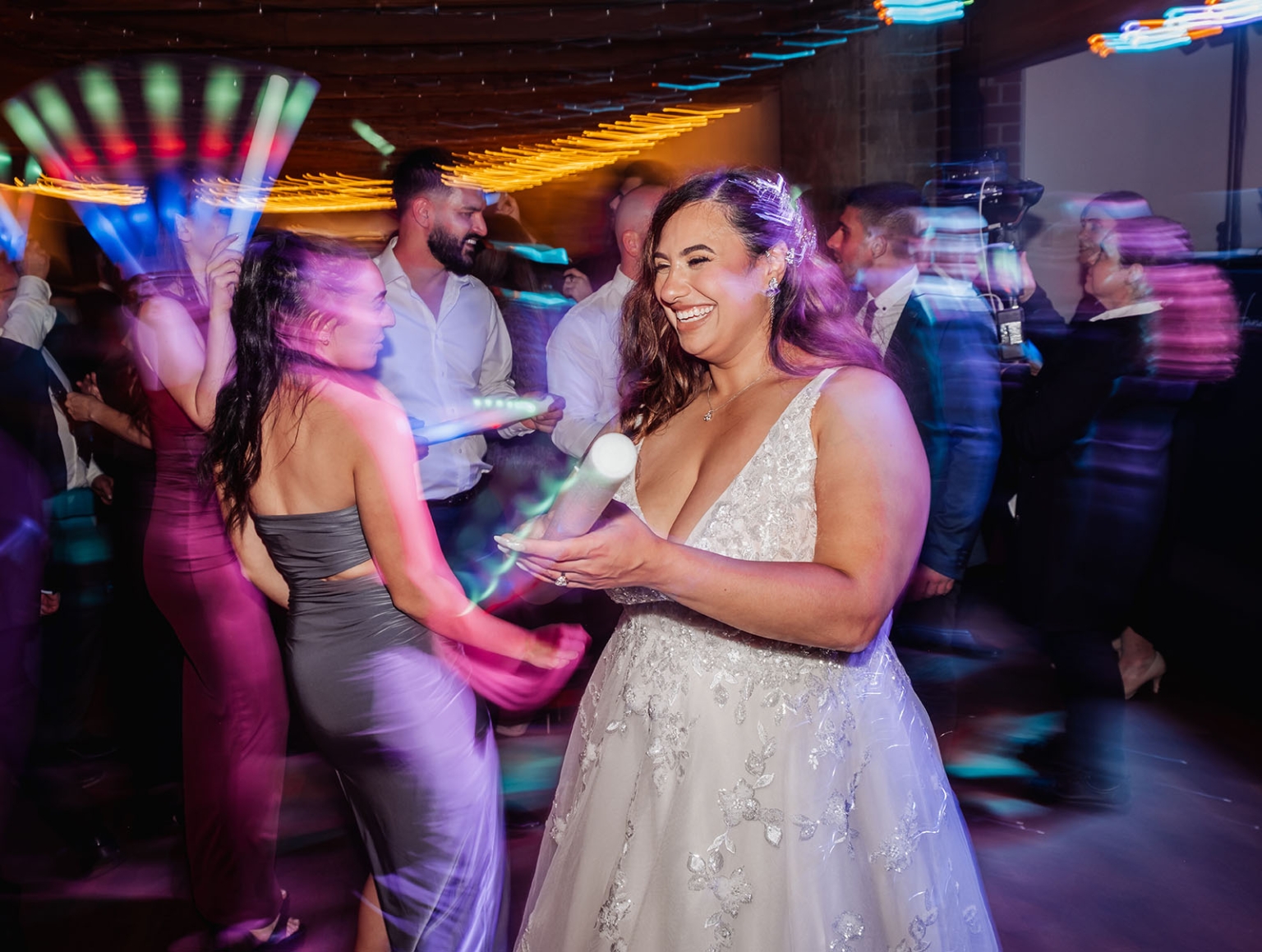 why a printable scavenger hunt qr code is becoming obsolete 3 Bride dancing with guests on colorful wedding reception dance floor.