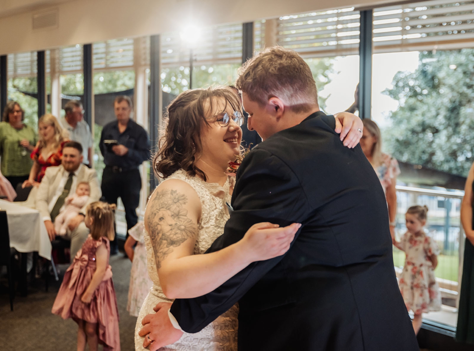 loxton's st peter's church wedding - madeline & brayden 63 Bride and groom share a joyful first dance at an intimate wedding reception.