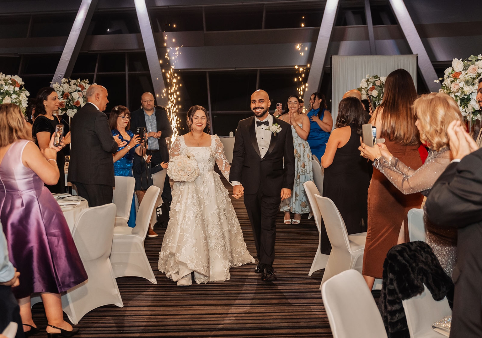 st george & st shenouda coptic church wedding - carmina & bill 83 Newlyweds make grand wedding reception entrance with indoor sparklers and applauding guests.