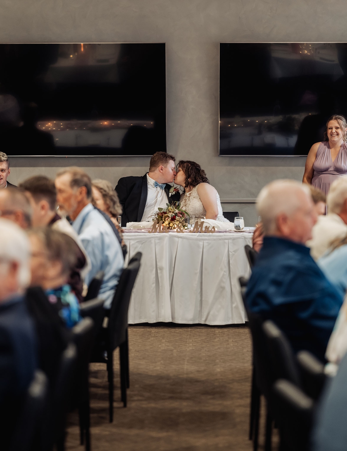 loxton's st peter's church wedding - madeline & brayden 58 Bride and groom kiss at elegant wedding reception head table.