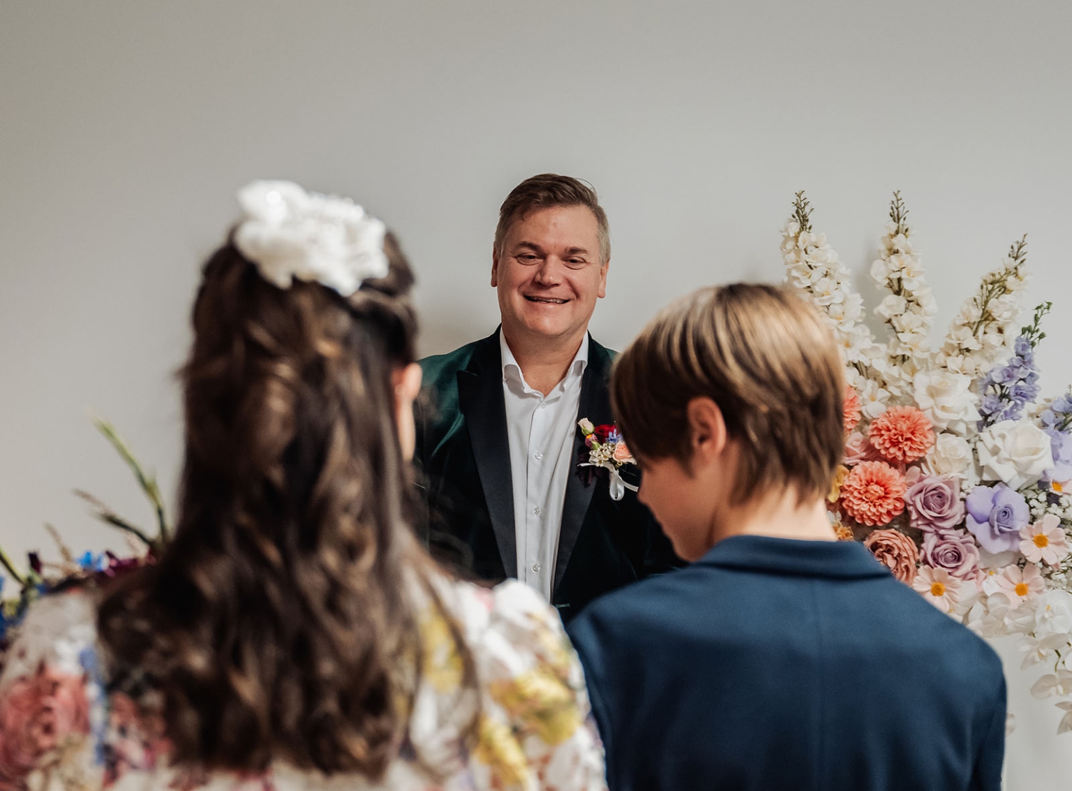sa marriage office wedding – melissa & kyran 197 Wedding officiant smiles at couple during intimate floral vow ceremony.