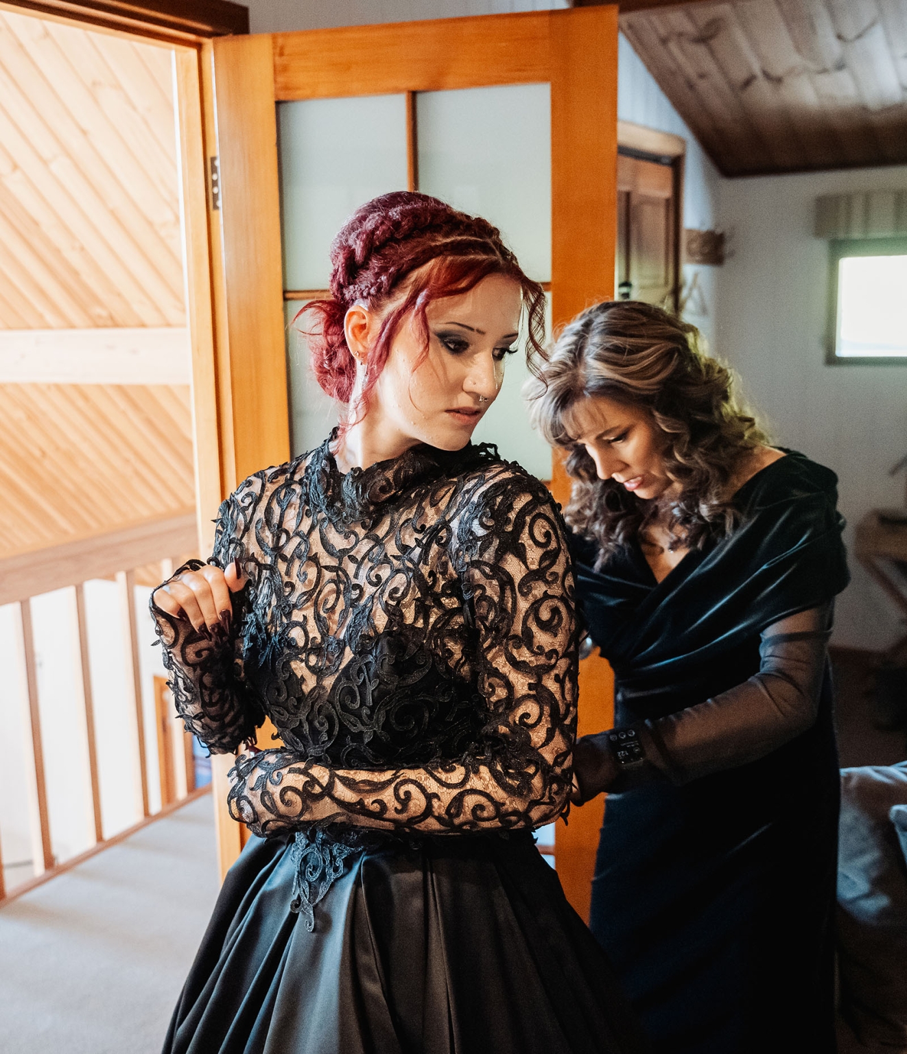 kuitpo hall wedding - courtney & jarrod 205 Gothic bride in black lace gown getting dressed in rustic room.