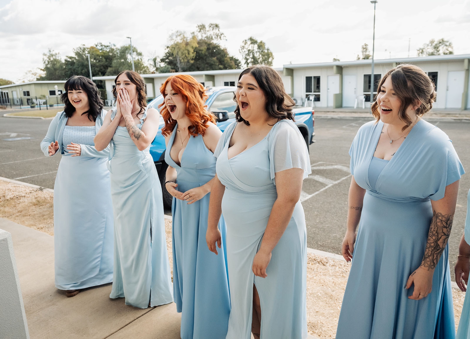capella wedding photography – caitlin & adam’s farm wedding 130 Five bridesmaids in matching light blue dresses laughing and reacting together outdoors