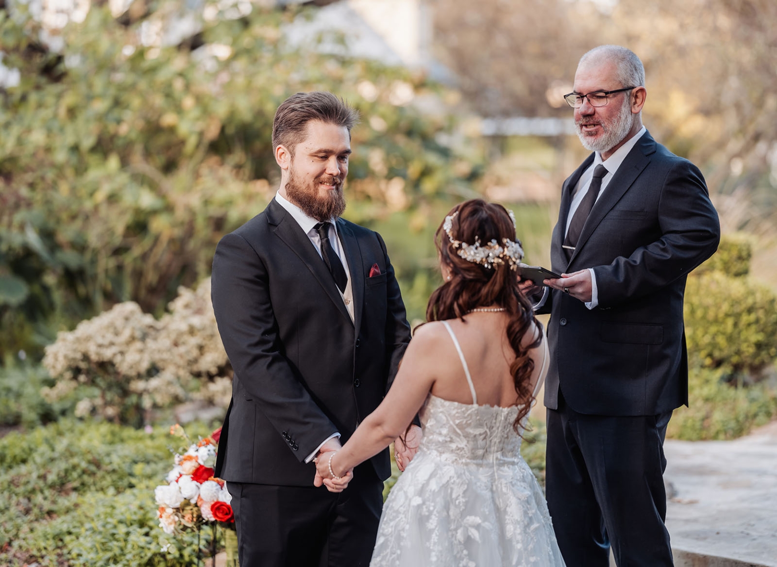 wedding at al-ru farm – teresa & thomas 22 Garden wedding ceremony with bride, groom, and officiant exchanging vows.