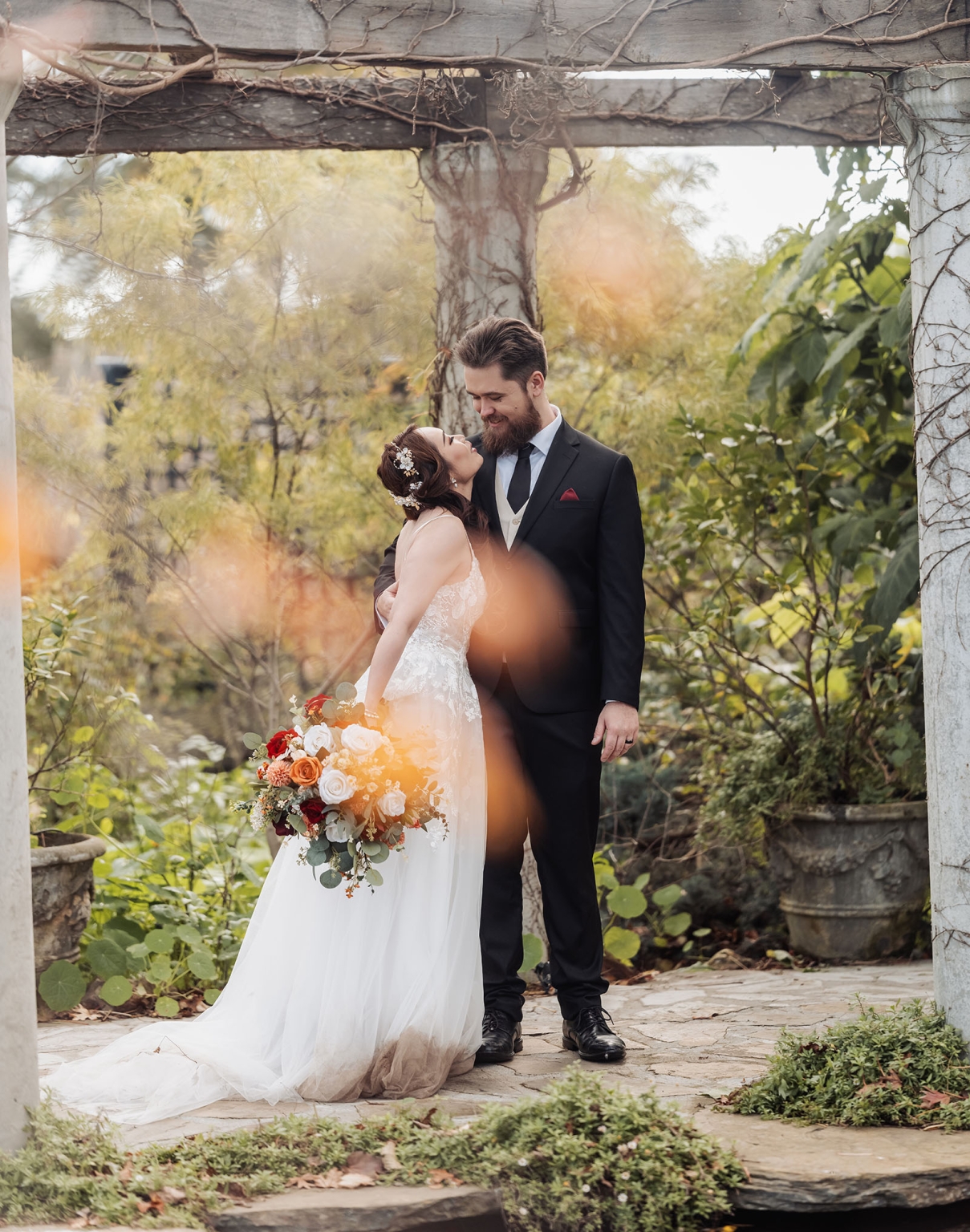 wedding at al-ru farm – teresa & thomas 36 Romantic garden wedding portrait of bride and groom beneath rustic pergola.