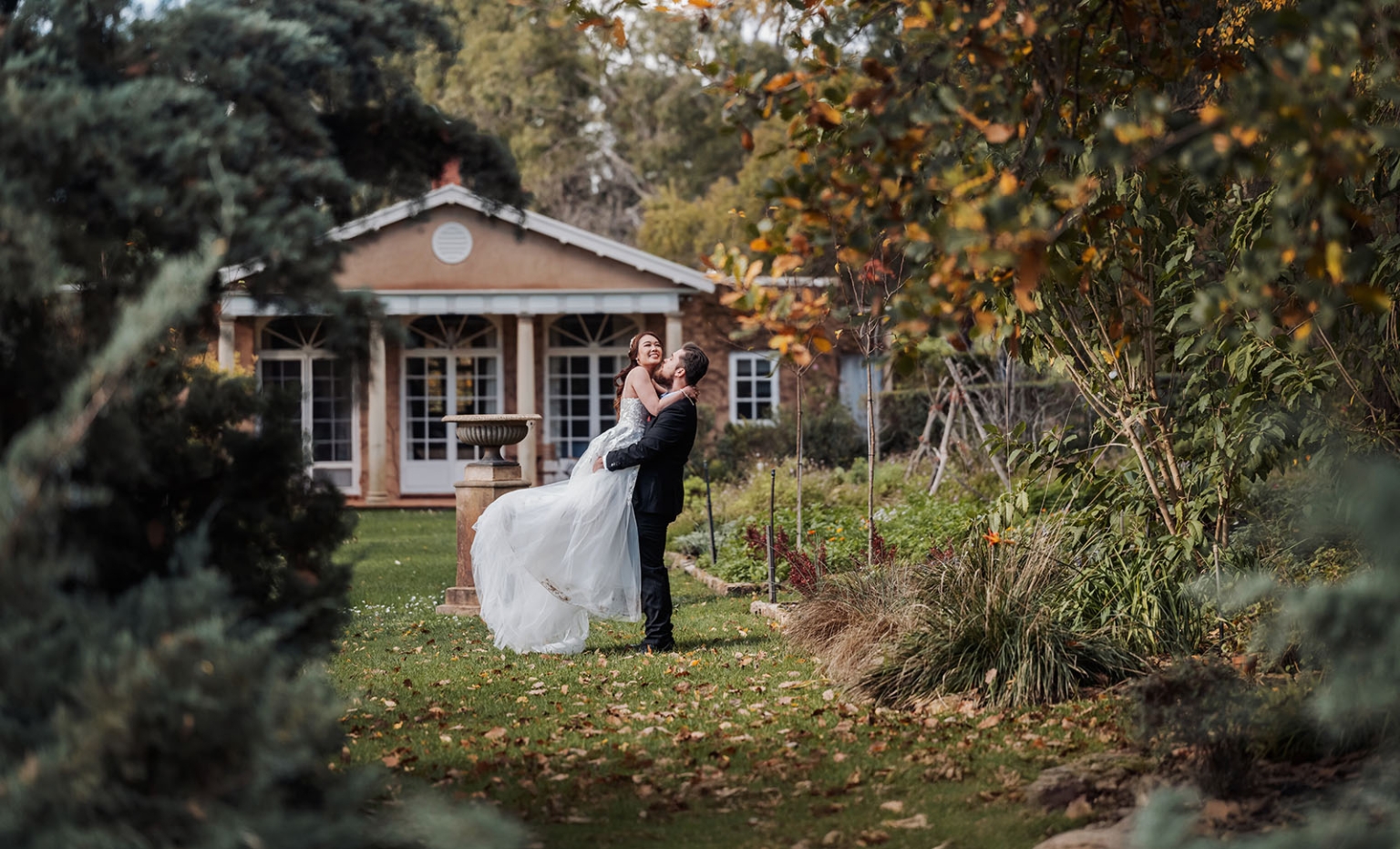 wedding at al-ru farm – teresa & thomas 6 Romantic garden wedding portrait of groom lifting bride in autumn estate setting.