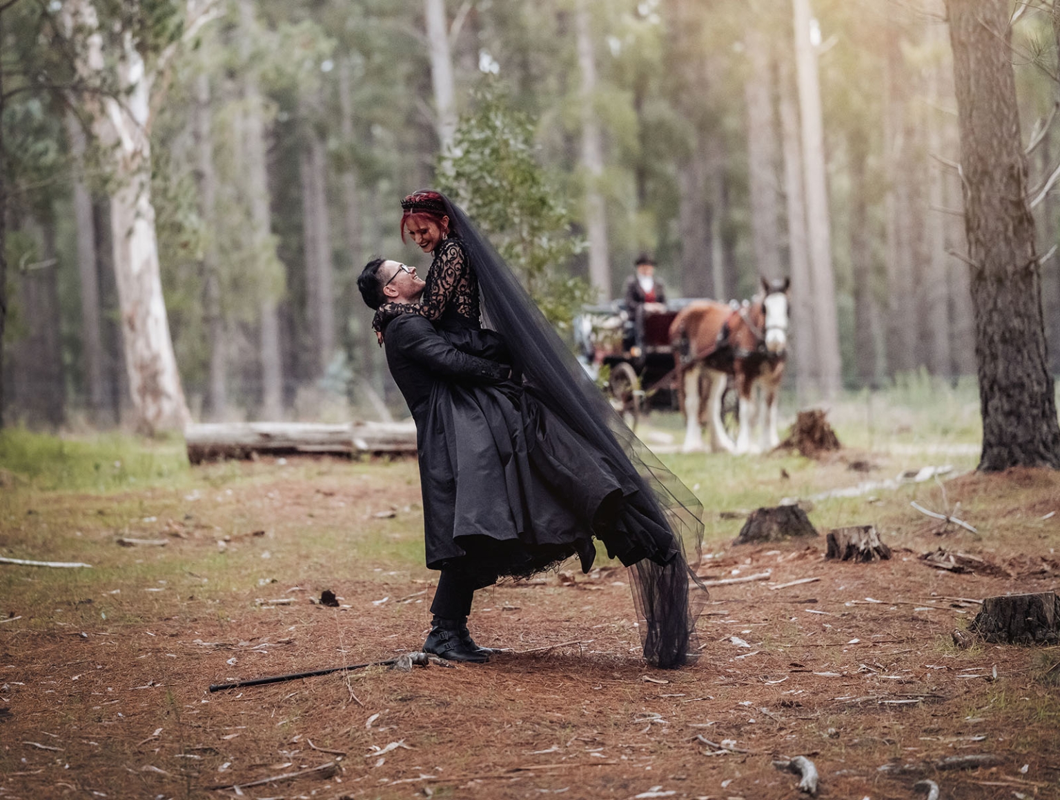 kuitpo hall wedding - courtney & jarrod 239 Gothic couple embracing in enchanted forest with horse-drawn carriage.