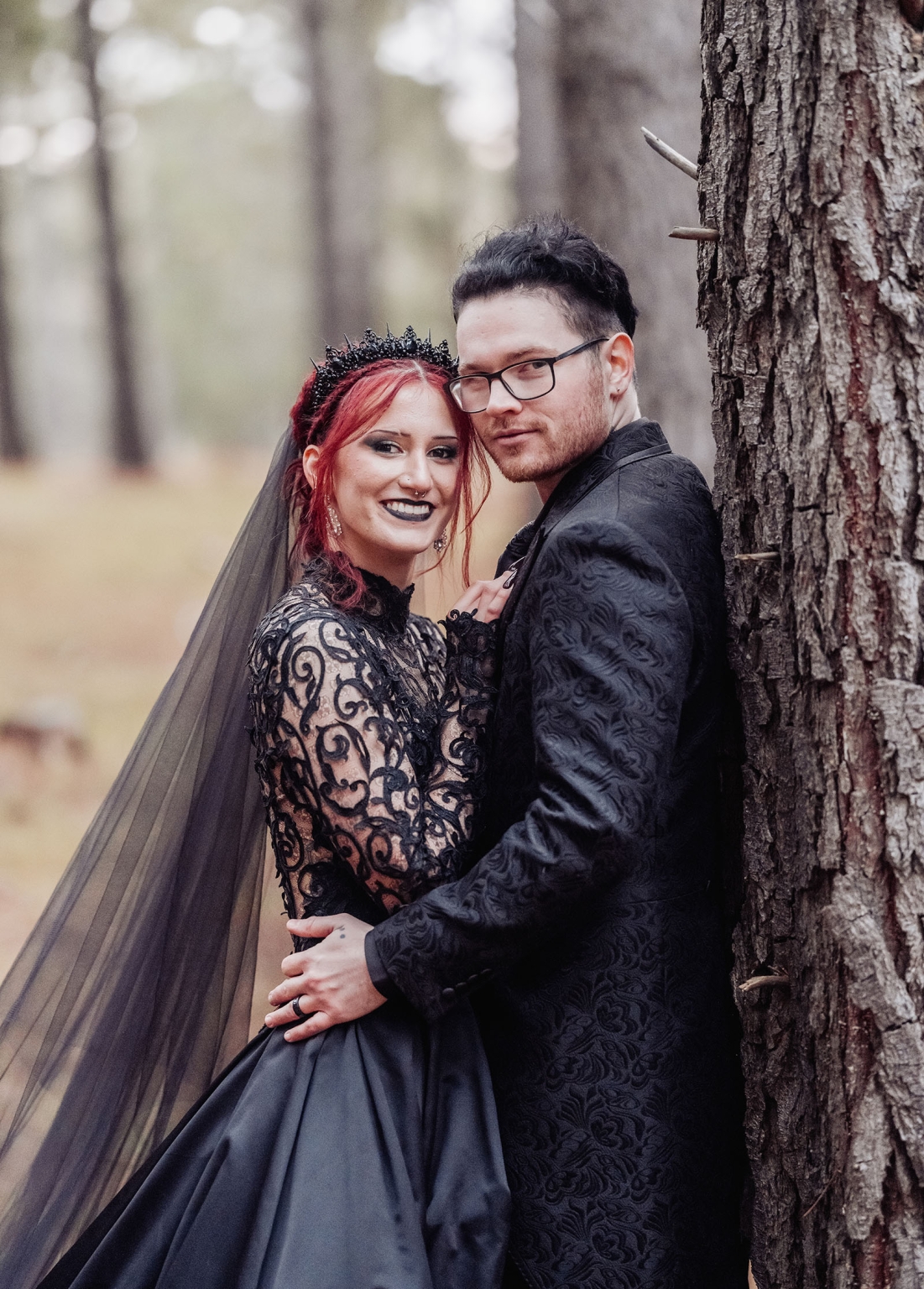 kuitpo hall wedding - courtney & jarrod 242 Gothic wedding couple in black attire posing in a moody forest portrait.