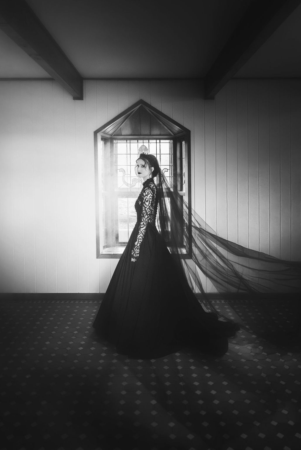 kuitpo hall wedding - courtney & jarrod 213 Gothic Victorian bride in black gown and veil before stained glass window.