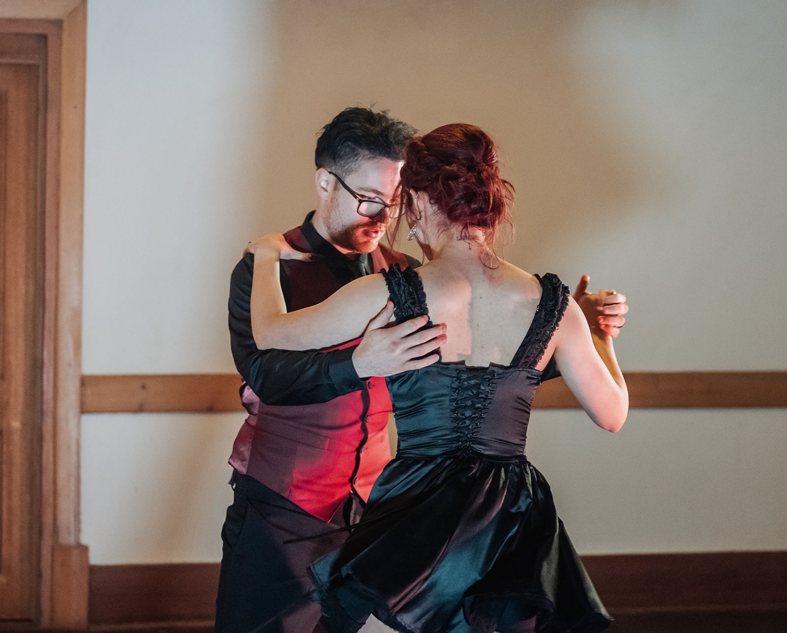 kuitpo hall wedding - courtney & jarrod 254 Couple dancing tango in formal attire during an intimate indoor ballroom moment.