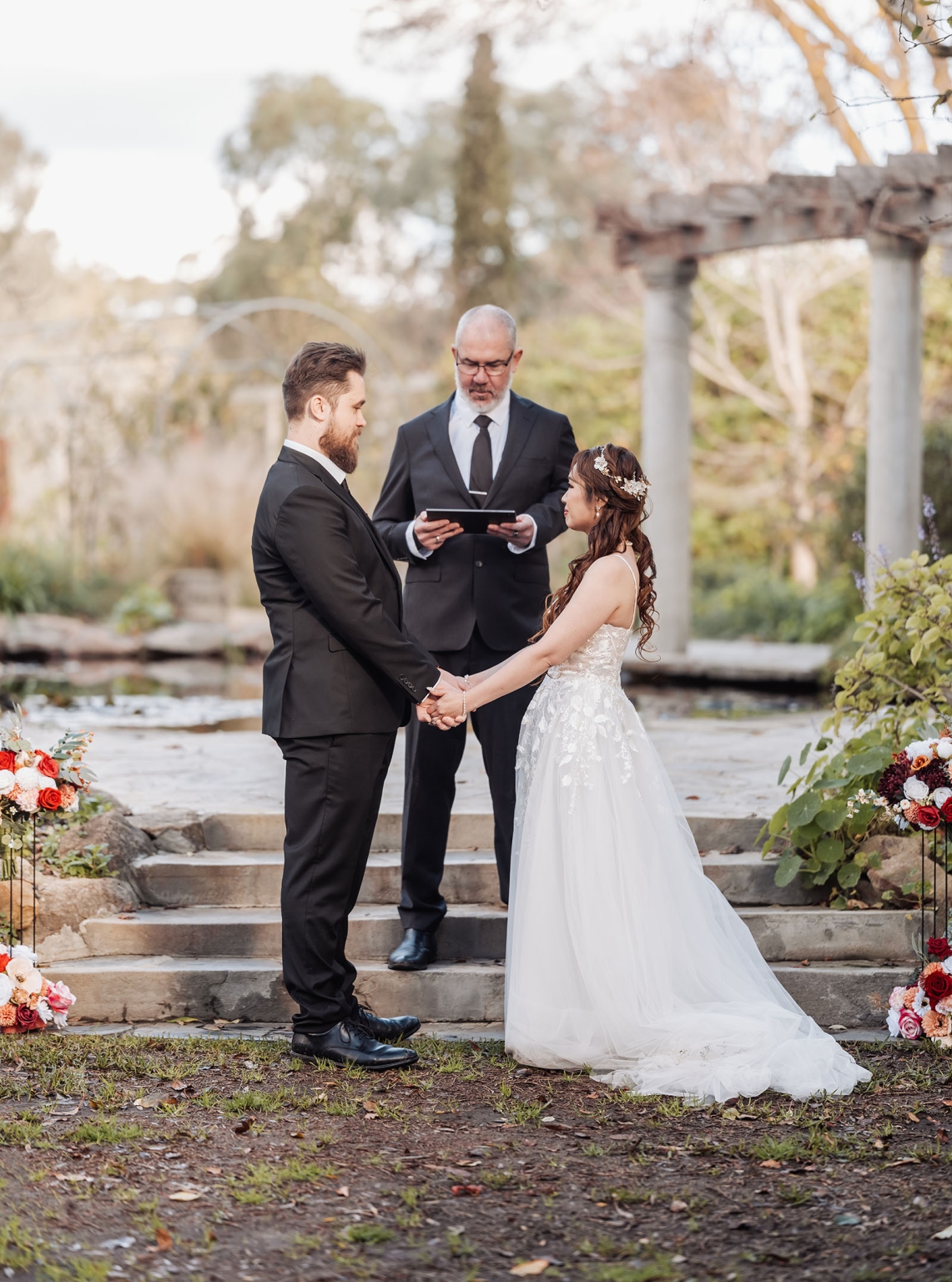 wedding at al-ru farm – teresa & thomas 20 Bride and groom exchange vows in a romantic garden wedding ceremony.