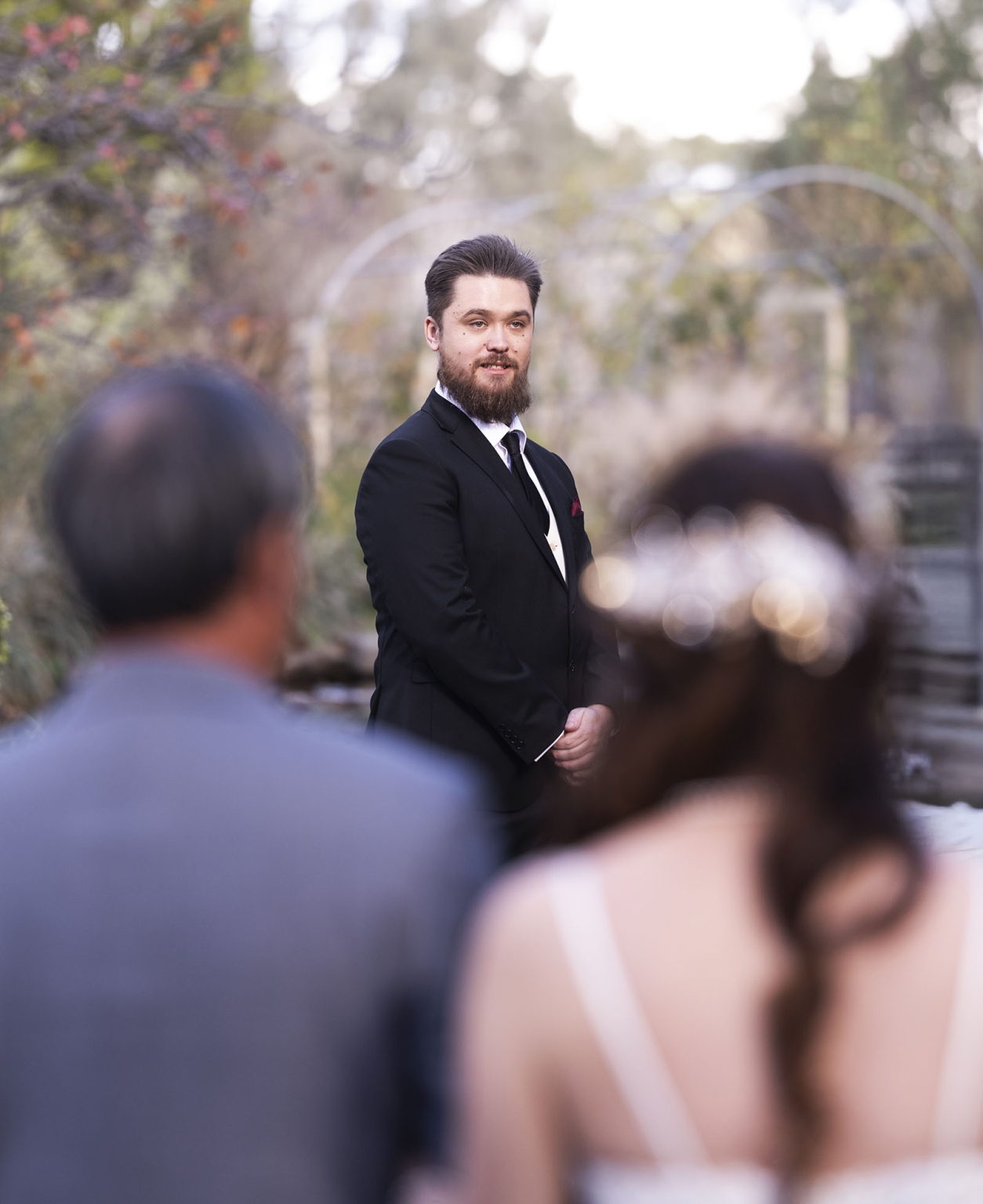 wedding at al-ru farm – teresa & thomas 18 Groom awaits bride during romantic outdoor garden wedding ceremony.