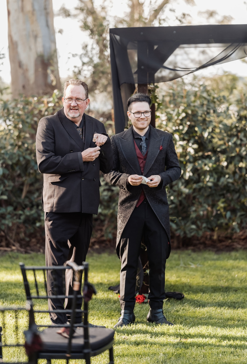 kuitpo hall wedding - courtney & jarrod 218 Groomsmen in black suits at an elegant outdoor gothic wedding ceremony.