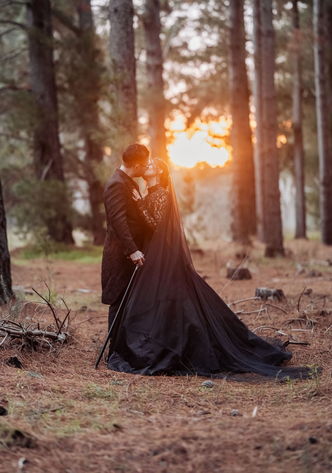 kuitpo hall wedding - courtney & jarrod 245 Romantic gothic wedding couple kissing in a pine forest at sunset.