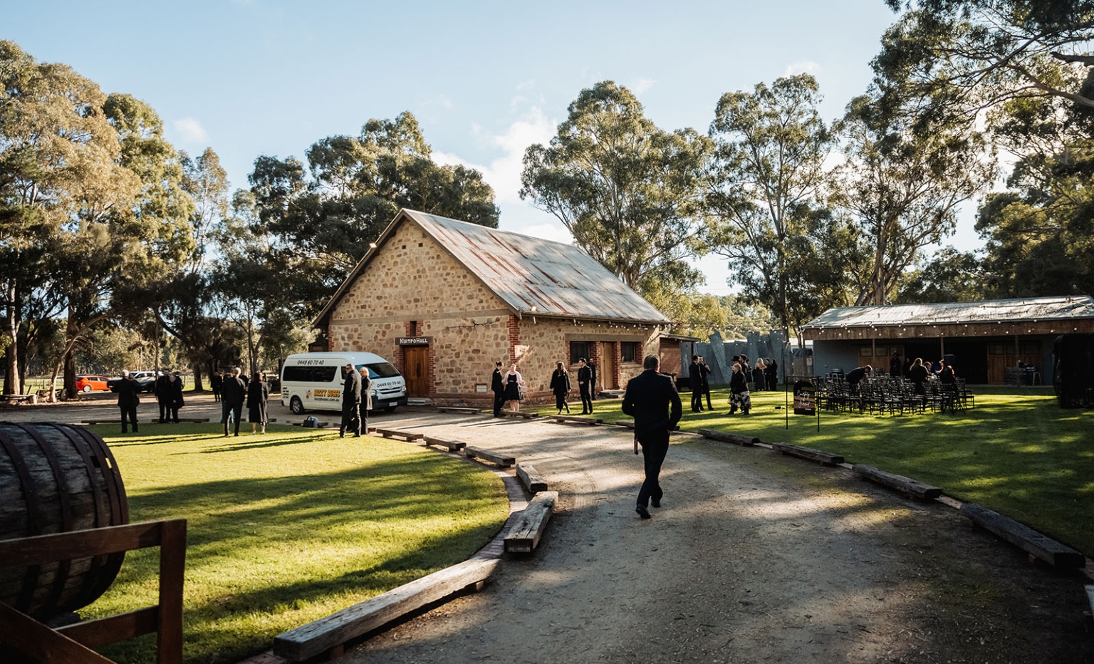 kuitpo hall wedding - courtney & jarrod 217 Rustic Kuitpo Hall outdoor wedding ceremony venue with stone building and eucalyptus trees.