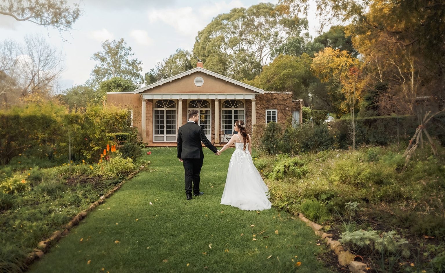 wedding at al-ru farm – teresa & thomas 9 Bride and groom walk garden path to romantic cottage wedding venue.