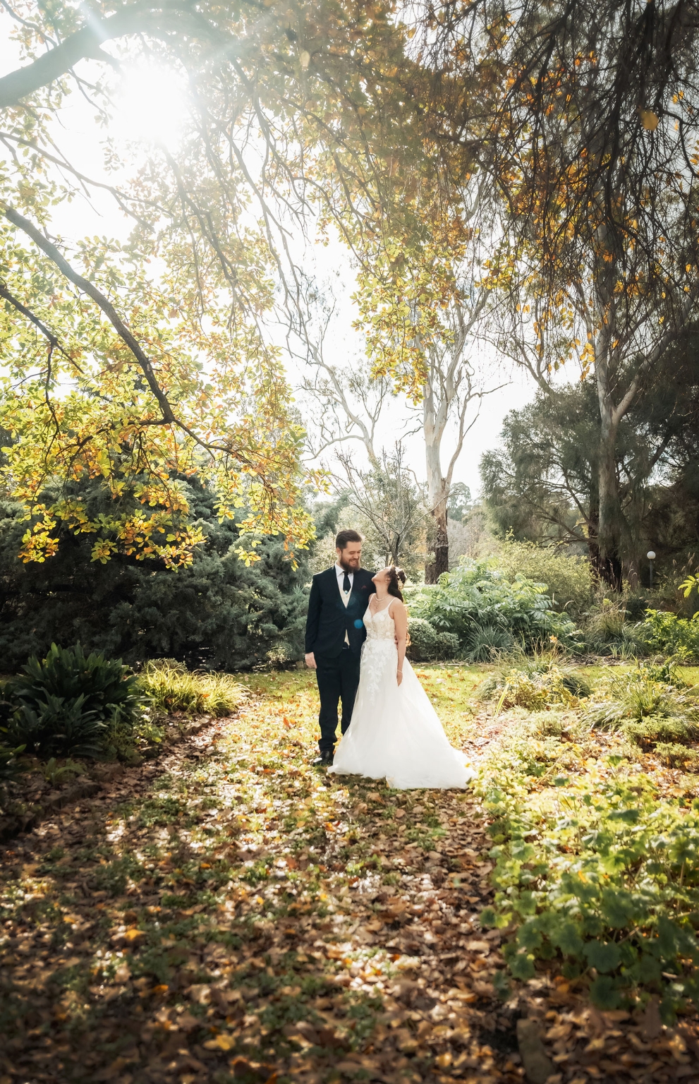 wedding at al-ru farm – teresa & thomas 5 Romantic wedding couple portrait in a sunlit garden with autumn trees.