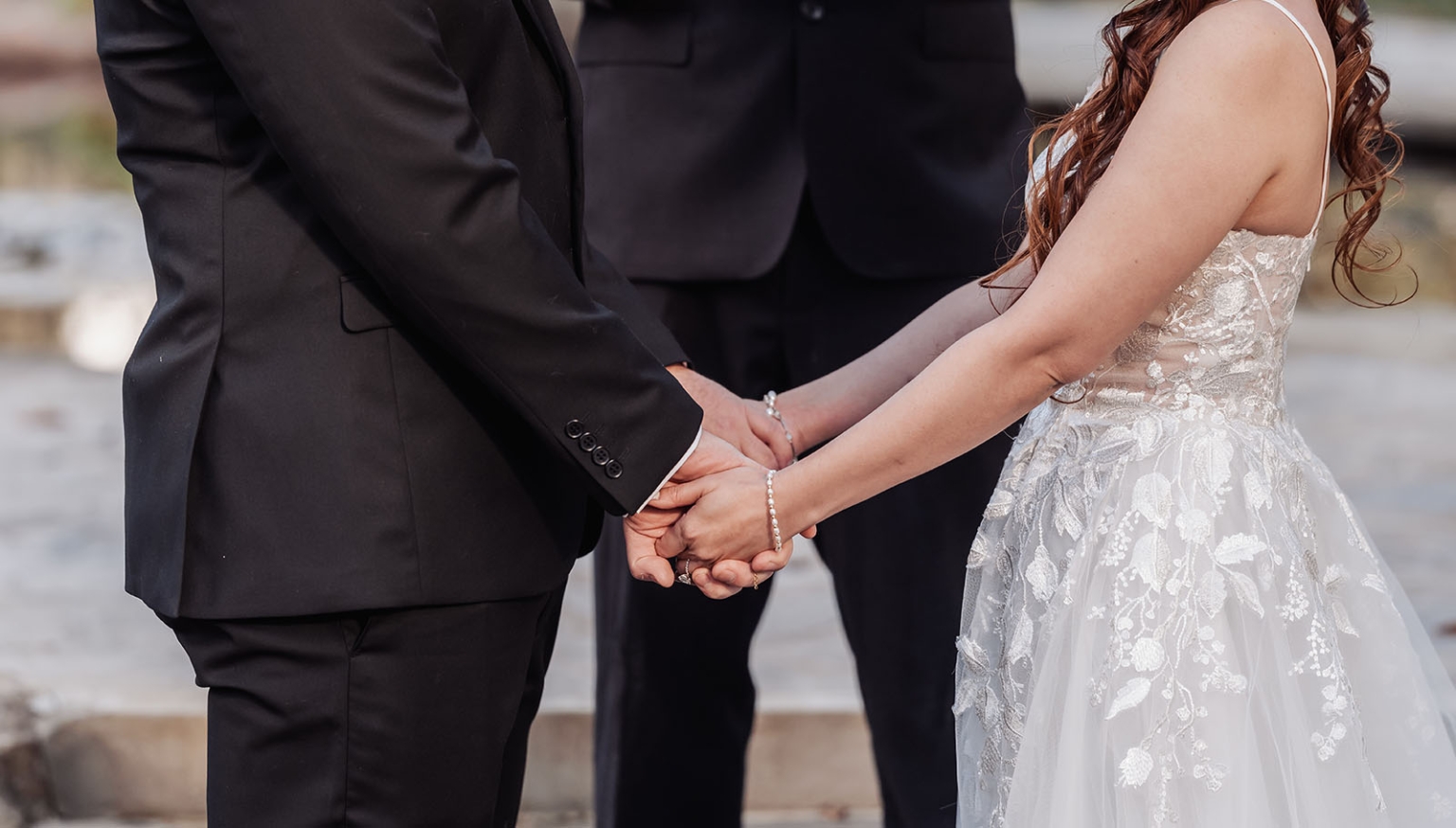 wedding at al-ru farm – teresa & thomas 21 Bride and groom holding hands during outdoor wedding ceremony.