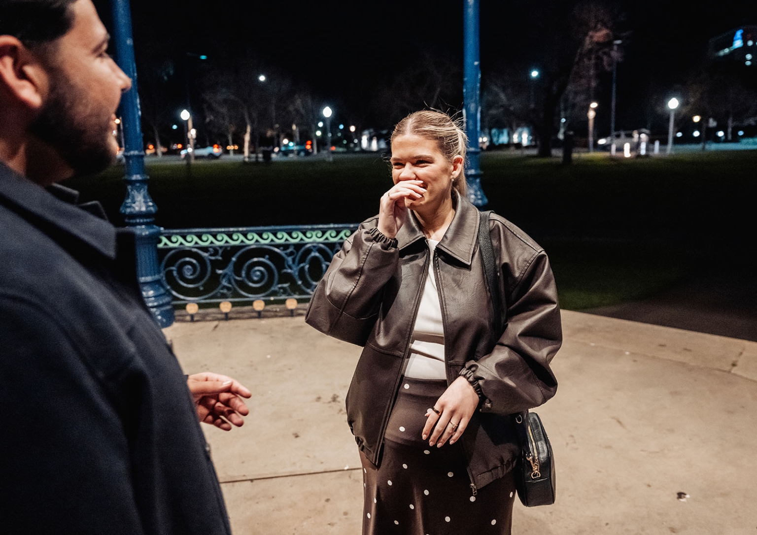 elder park rotunda proposal - lauren & enrique 5 Lauren reacts emotionally beside Enrique during their nighttime proposal at Elder Park Rotunda.