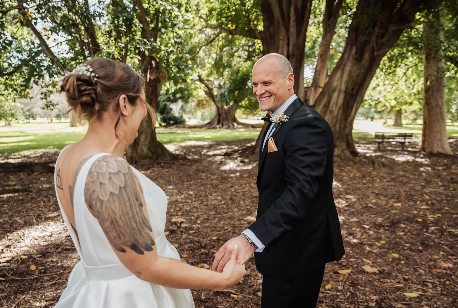 marriage registration office wedding - mia & roberto 51 Mia and Roberto holding hands beneath Moreton Bay fig trees in Adelaide Botanic Park