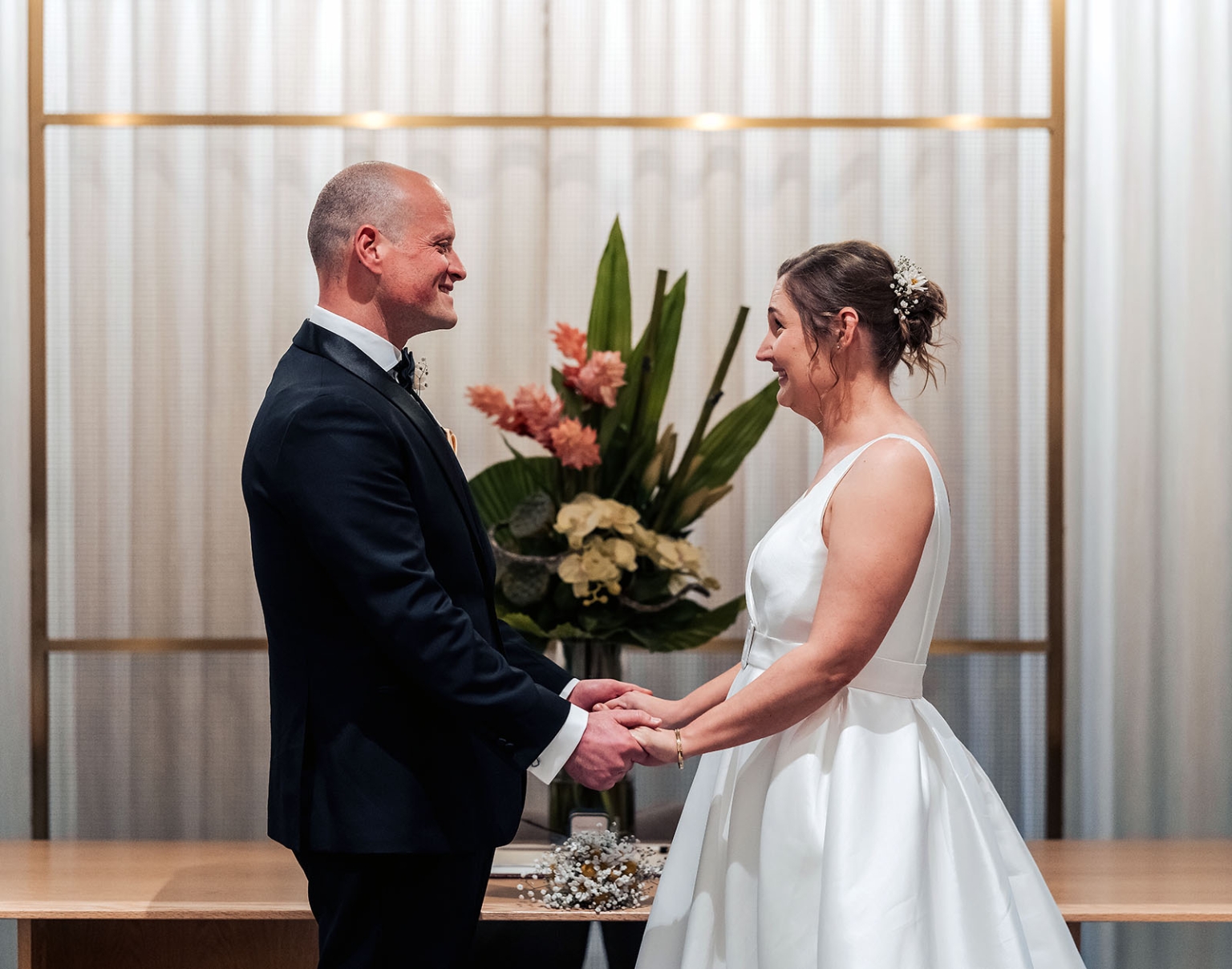 marriage registration office wedding - mia & roberto 88 Mia and Roberto smiling and holding hands during their ceremony at the Adelaide Marriage and Registration Office