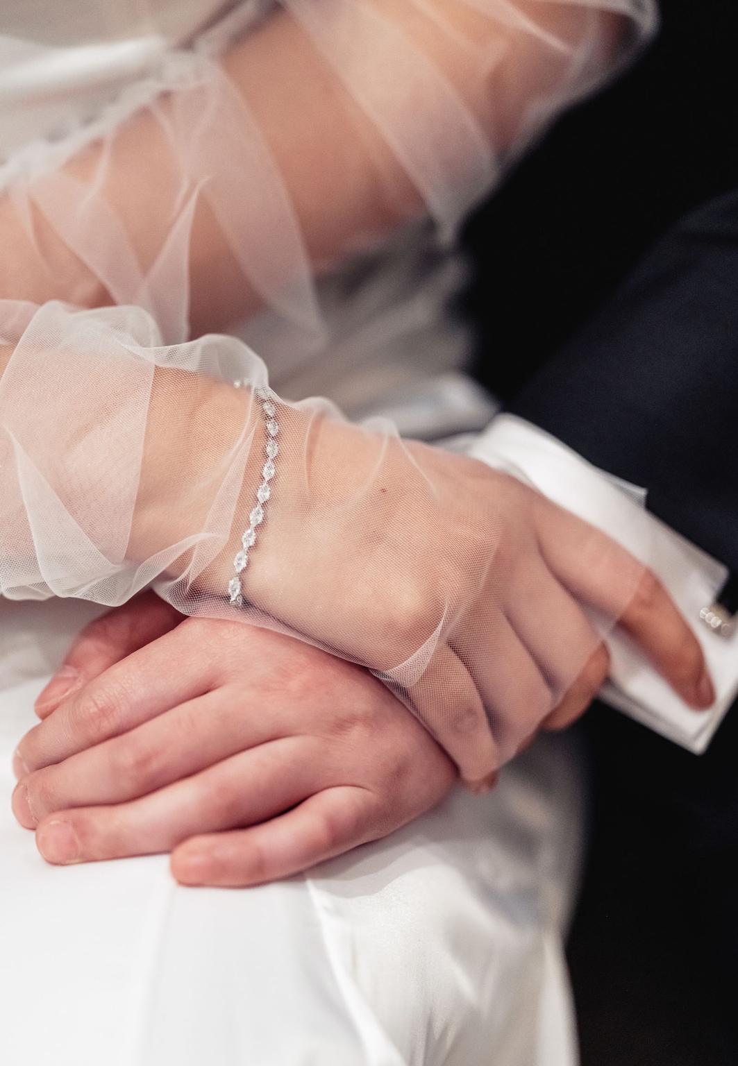 marriage rego office wedding – teri & thomas 12 Bride’s hand in a sheer sleeve resting over her partner’s hand during their Adelaide registration office wedding