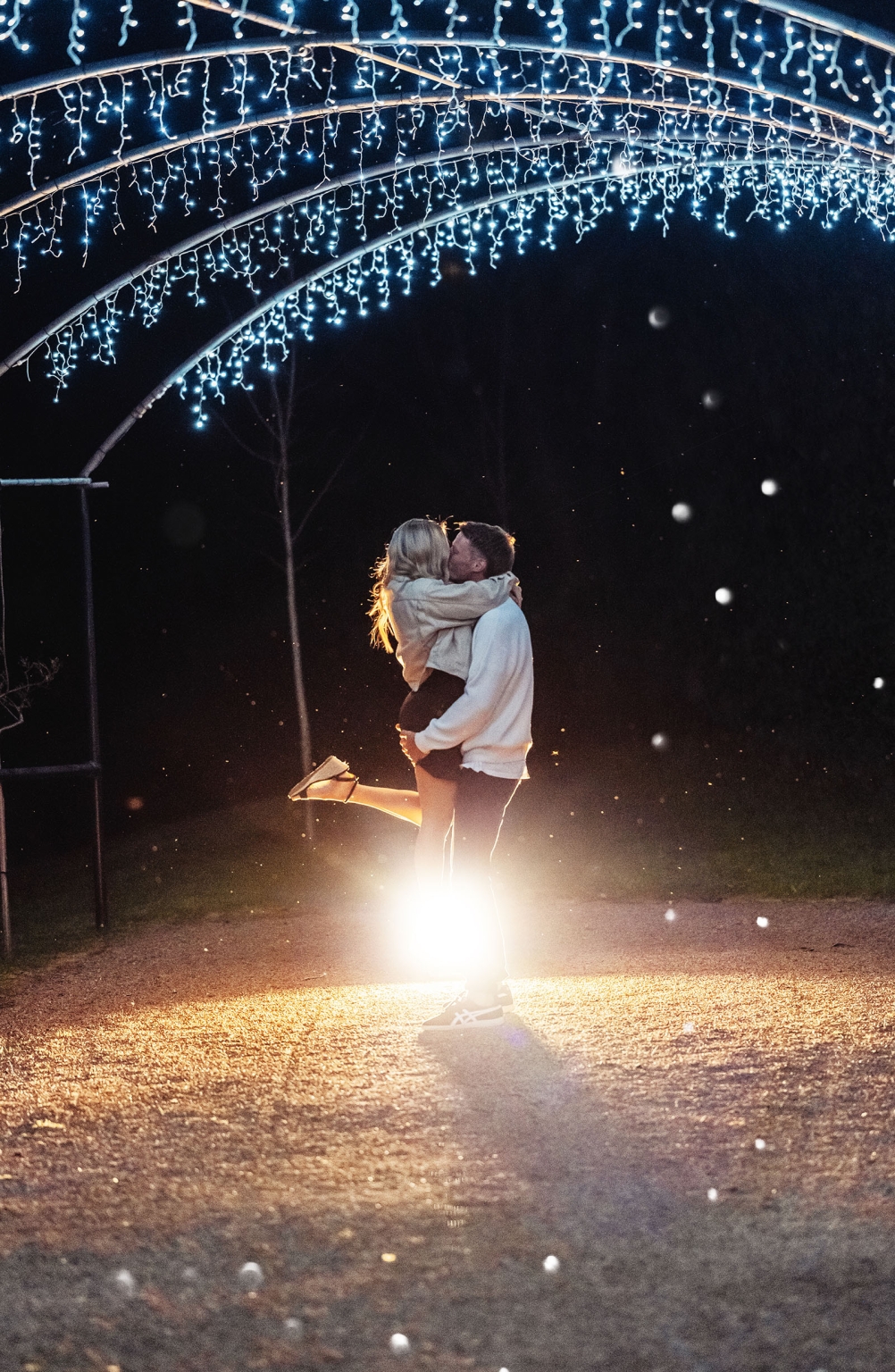 tiny house on the prairie proposal - kyle & bianca 14 Kyle and Bianca embracing beneath a fairy-light arch during their Tiny House on the Prairie proposal