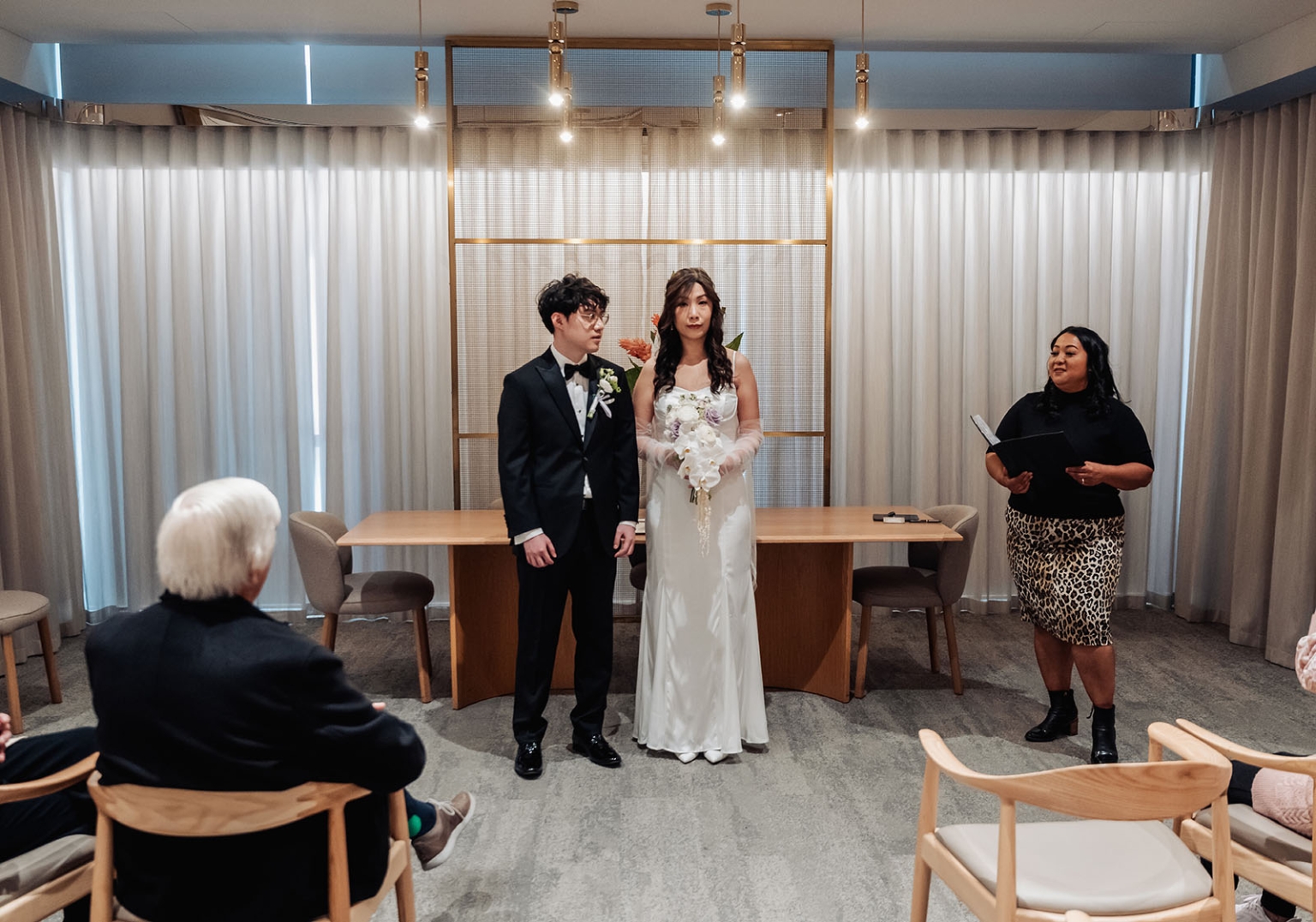 marriage rego office wedding – teri & thomas 2 Teri and Thomas stand with their marriage celebrant during their intimate ceremony at the Adelaide Marriage Registration Office.