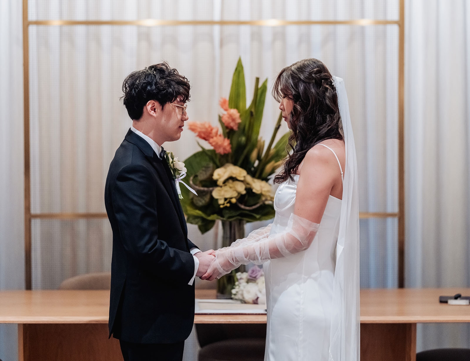 marriage rego office wedding – teri & thomas 7 Teri and Thomas holding hands during their wedding ceremony at the Adelaide Marriage and Registration Office