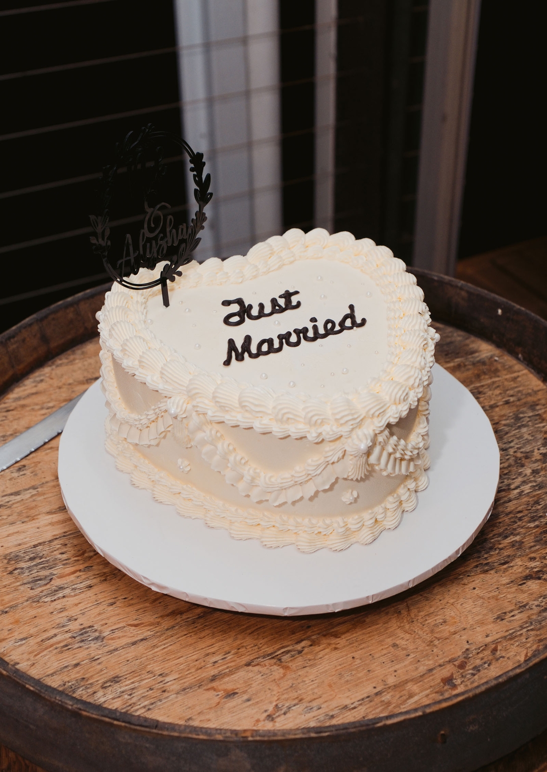 beach road winery wedding – alysha & nik 47 Heart-shaped white wedding cake with piped icing, a Just Married message and an Alysha and Nik topper