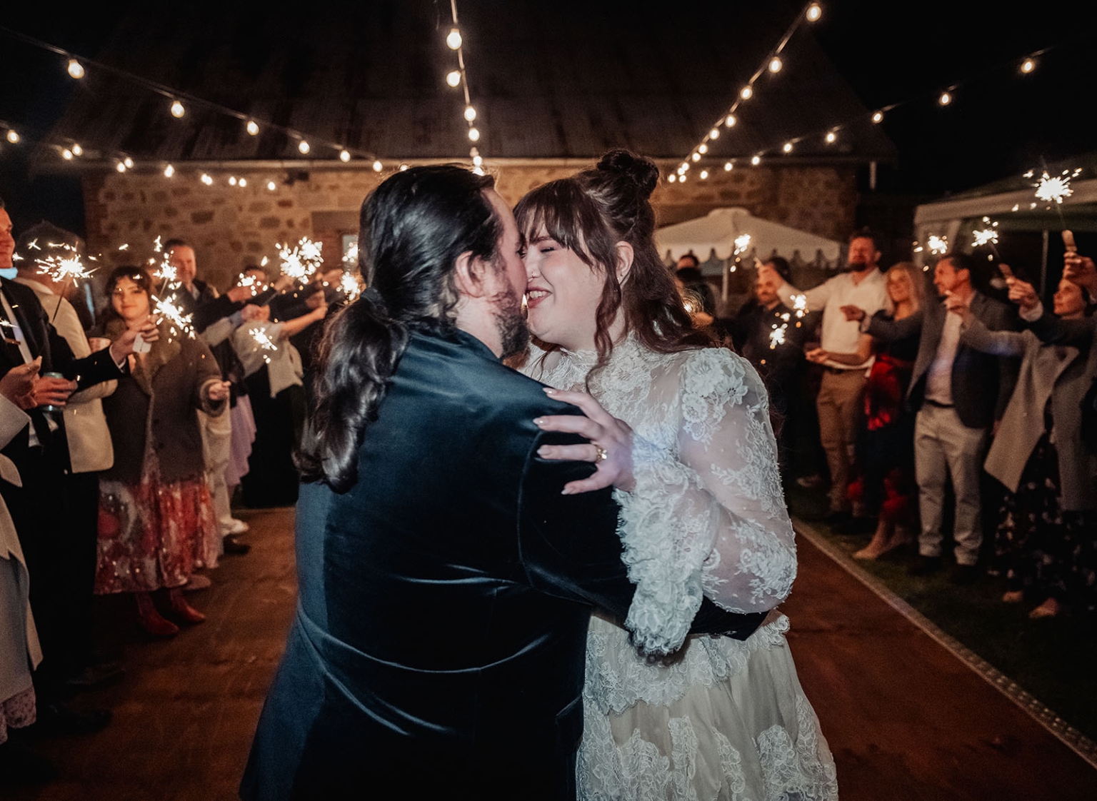 burbrook wedding – amber & angus | kuitpo forest wedding 61 Amber and Angus dancing beneath festoon lights as wedding guests hold sparklers around them