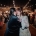 Amber and Angus dancing beneath festoon lights as wedding guests hold sparklers around them