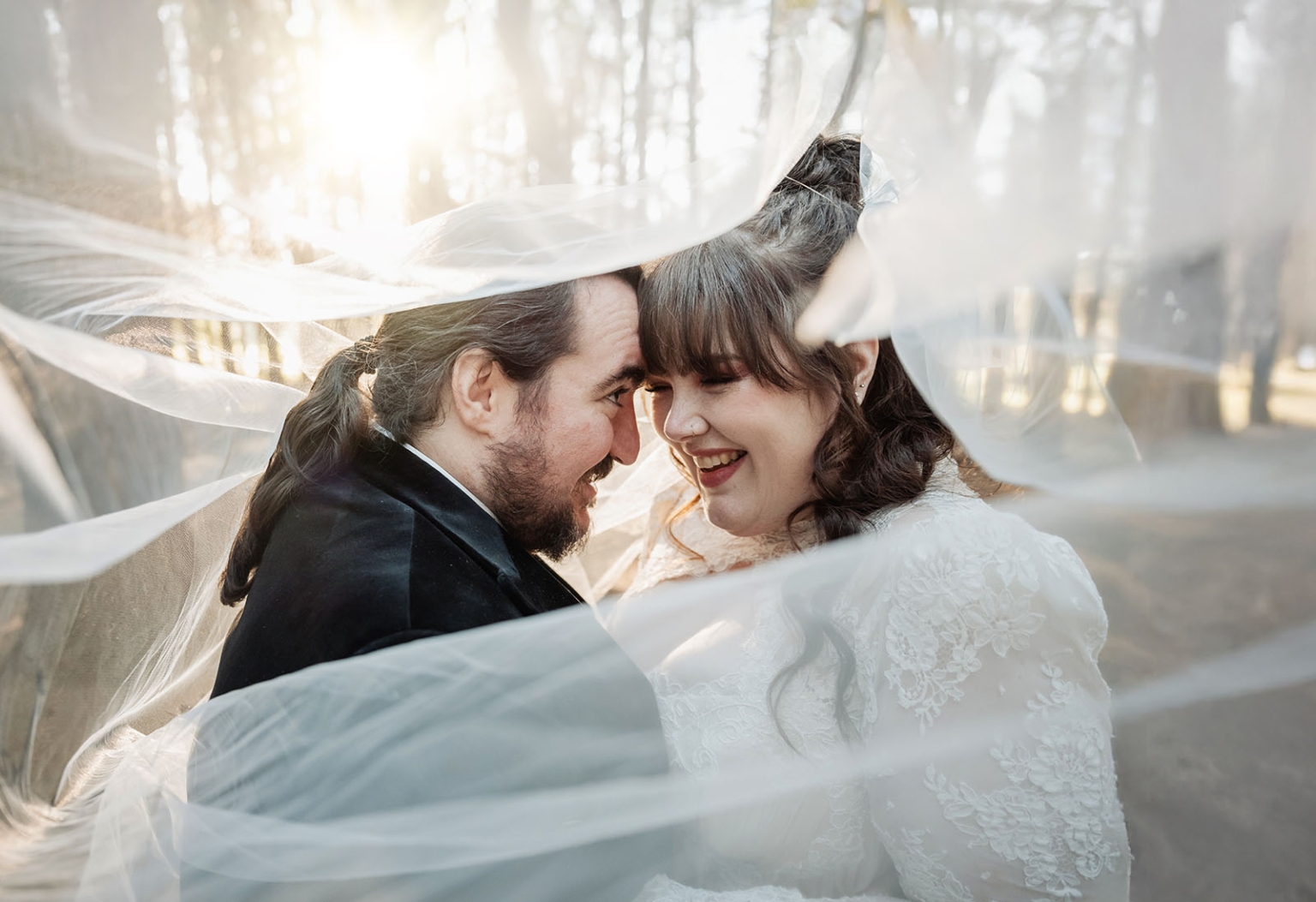 burbrook wedding – amber & angus | kuitpo forest wedding 38 Amber and Angus smiling forehead to forehead beneath her flowing wedding veil in Kuitpo Forest