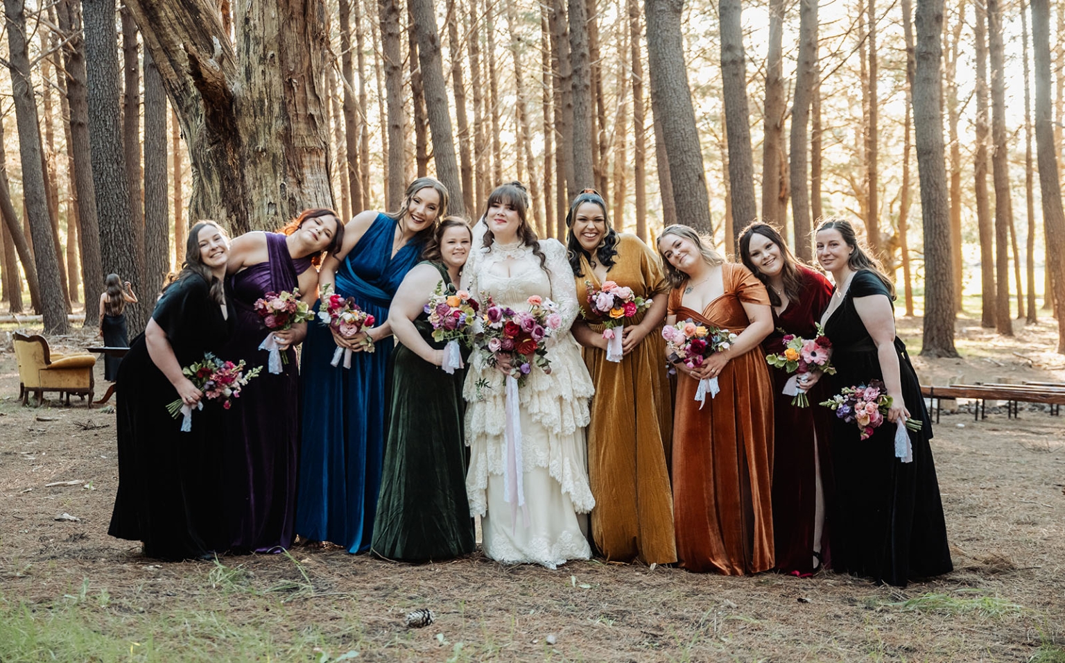burbrook wedding – amber & angus | kuitpo forest wedding 35 Amber with her bridesmaids holding colourful bouquets among tall trees in Kuitpo Forest