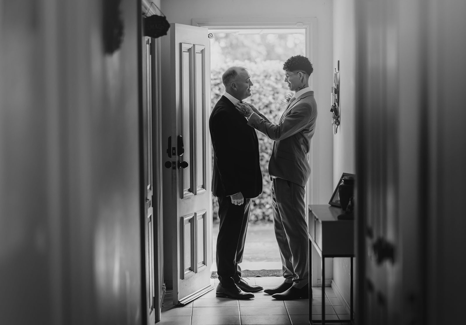 hotel royal wedding - brad & manuel 7 Manuel adjusts Brad’s tie as the two grooms prepare for their wedding at home.