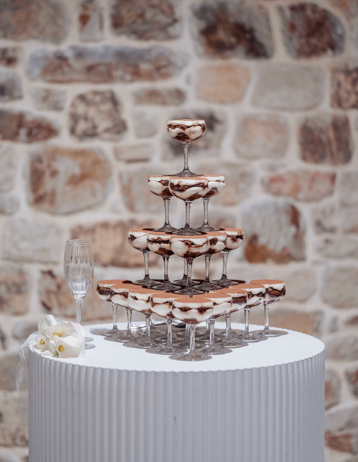 st joseph's chapel wedding – diana & michael 42 Tiered tower of chocolate and cream dessert coupes on a white table beside a single flute glass and white flowers