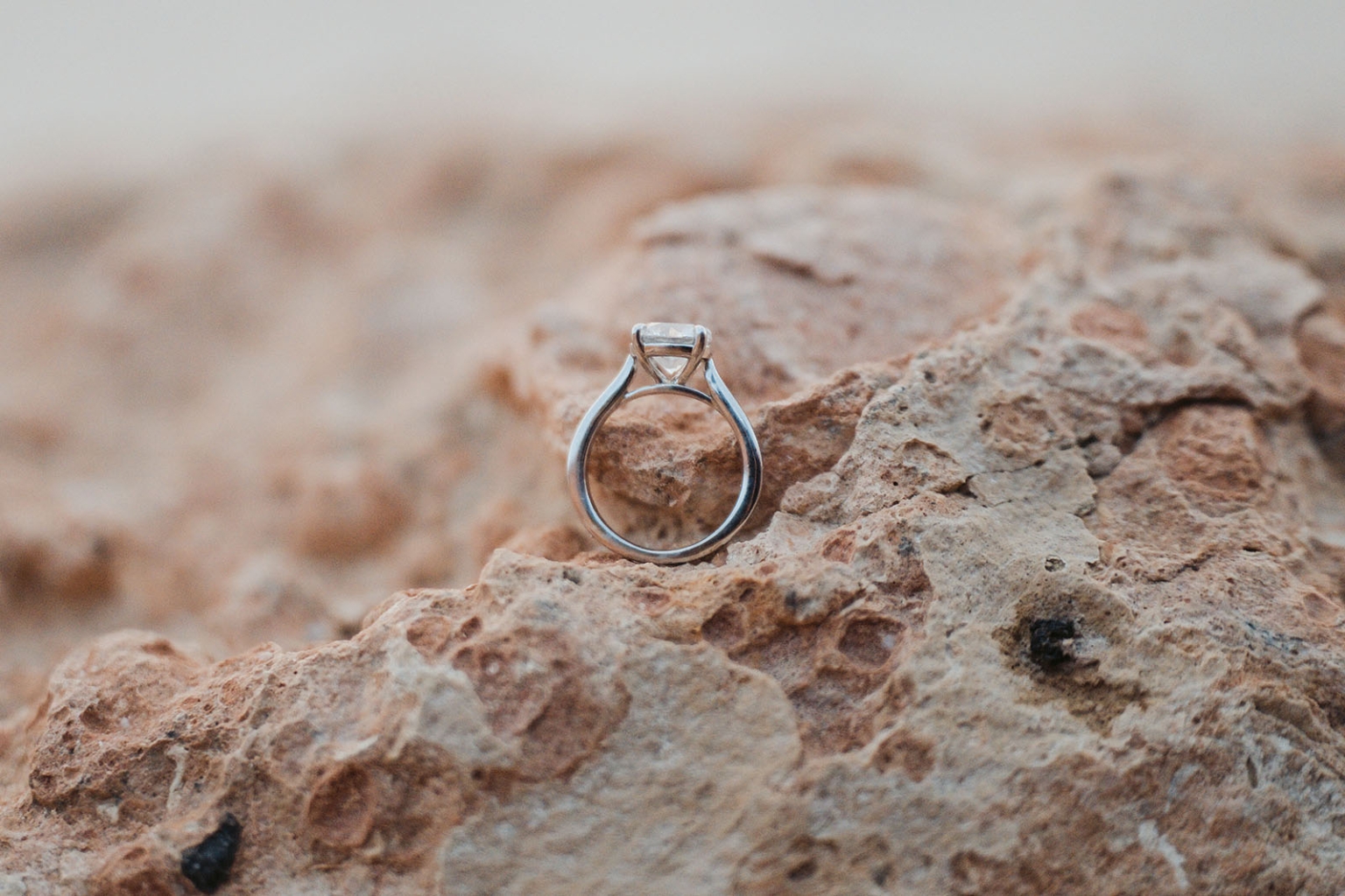 moonta's simms cove proposal – zoe & nathan 21 Engagement ring standing on textured coastal rocks at Simms Cove, Moonta