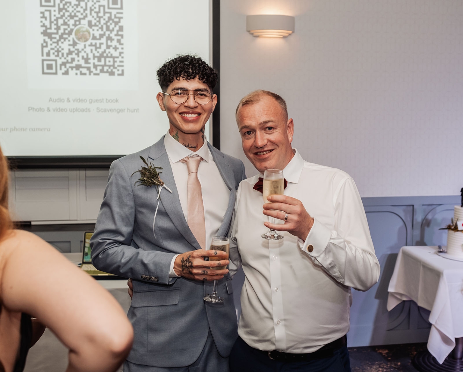 hotel royal wedding - brad & manuel 46 Two grooms smiling and holding champagne glasses during their wedding reception at Hotel Royal