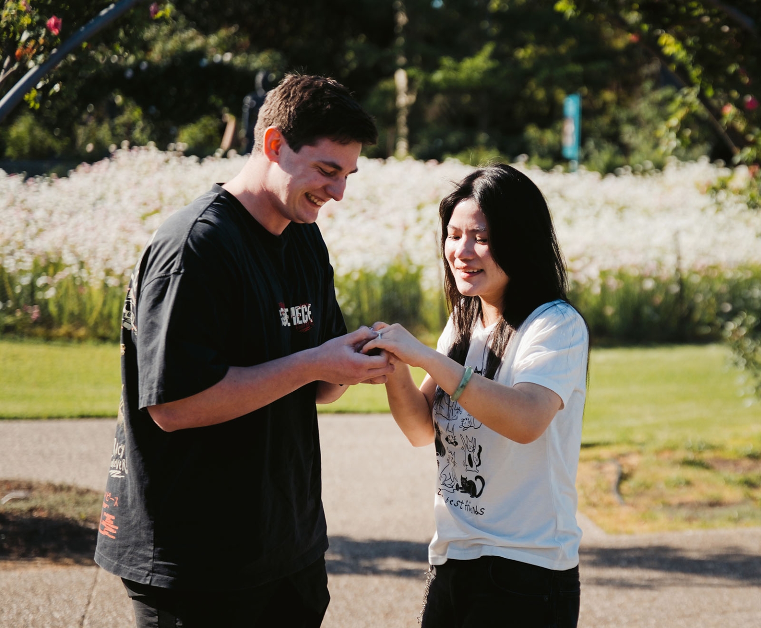 adelaide botanic gardens proposal – stewart & levi 3 Stewart holds Levi’s hand as they smile together during their proposal at Adelaide Botanic Gardens.