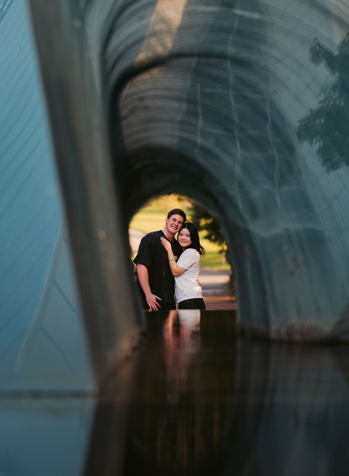 adelaide botanic gardens proposal – stewart & levi 8 Stewart and Levi embracing beneath a curved metal tunnel at Adelaide Botanic Gardens