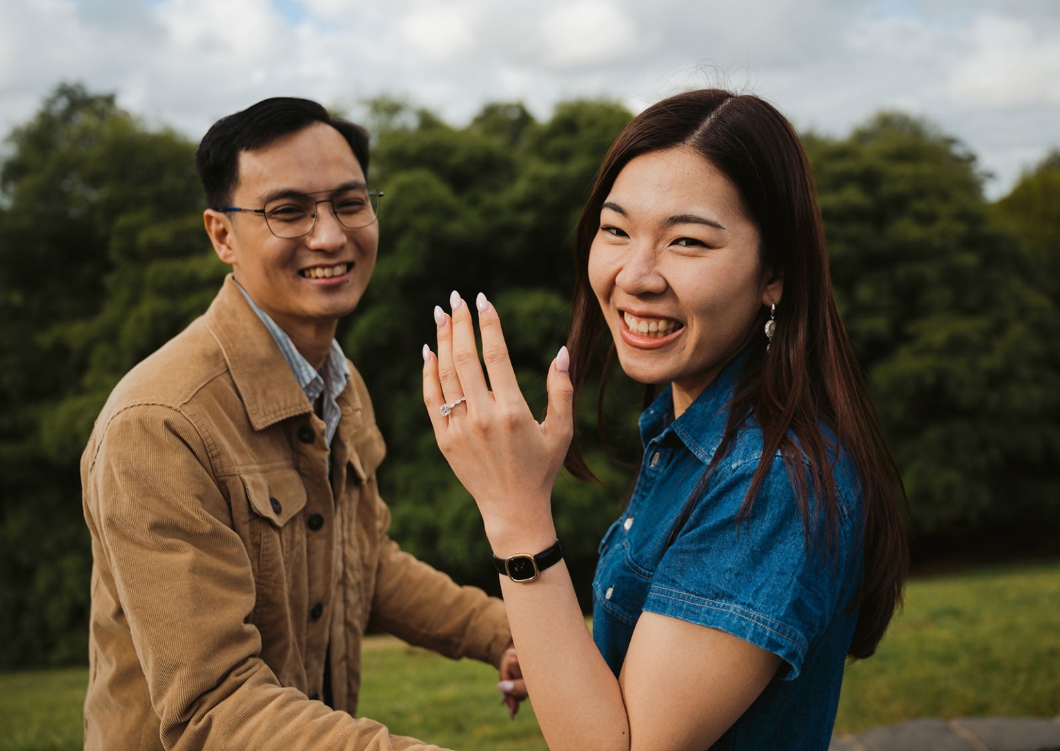 mt lofty botanic park proposal – watay & phouthun 25 Watay smiling and showing her engagement ring beside Phouthun at Mount Lofty Botanic Garden