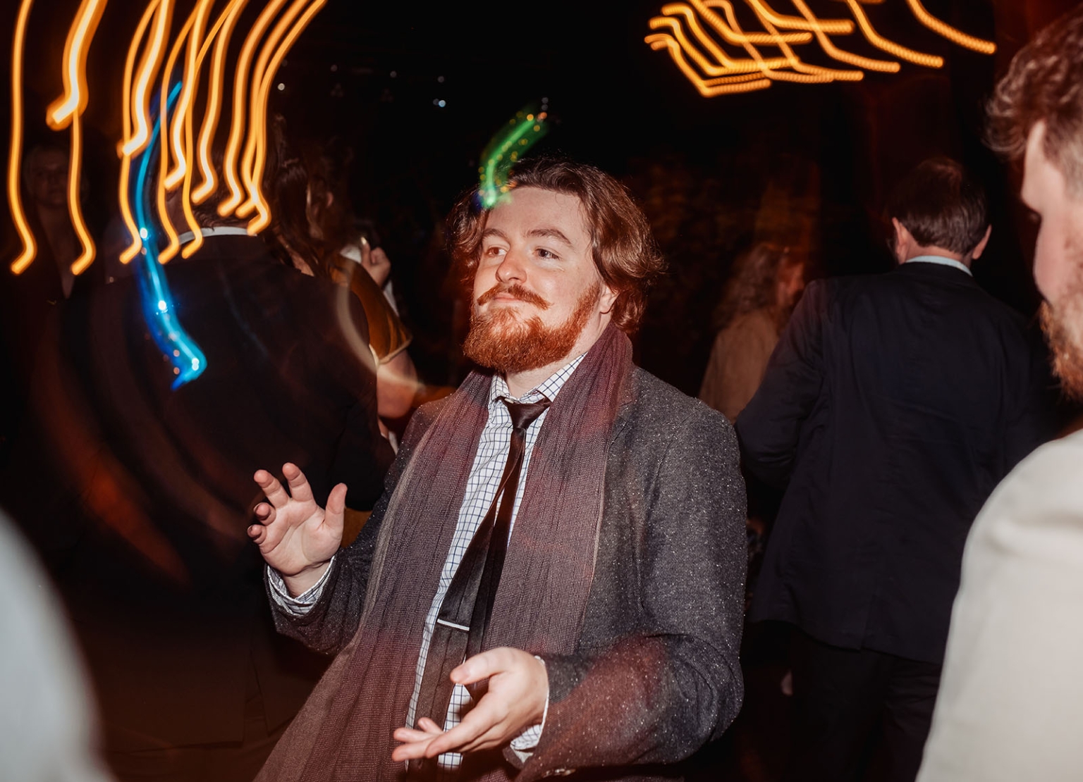 burbrook wedding – amber & angus | kuitpo forest wedding 64 Wedding guest dancing among a crowded dance floor with colourful light trails overhead