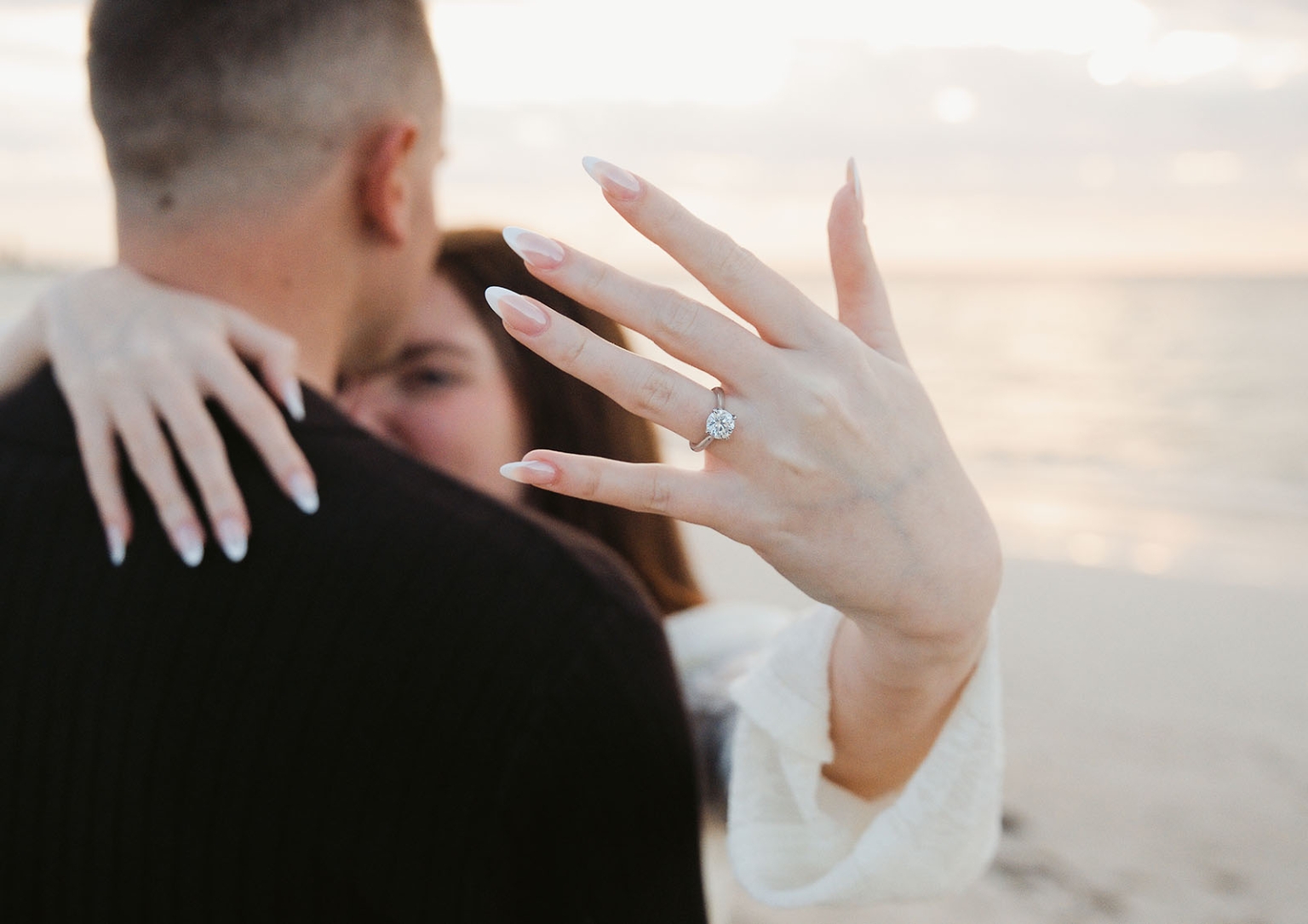 moonta's simms cove proposal – zoe & nathan 16 Zoe embraces Nathan and displays her diamond engagement ring at Simms Cove, Moonta.