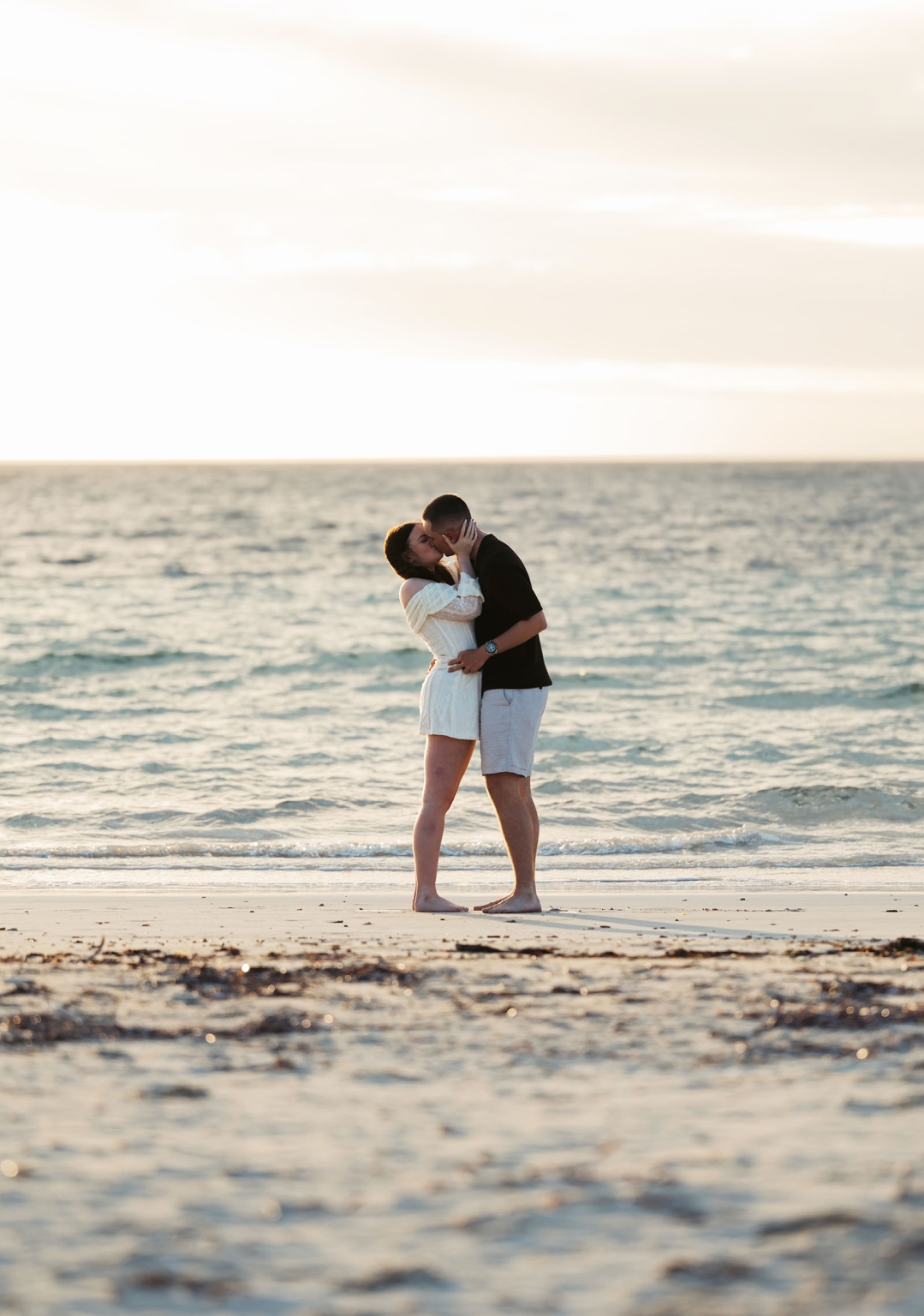 moonta's simms cove proposal – zoe & nathan 2 Zoe and Nathan kissing barefoot on the beach at Simms Cove, Moonta