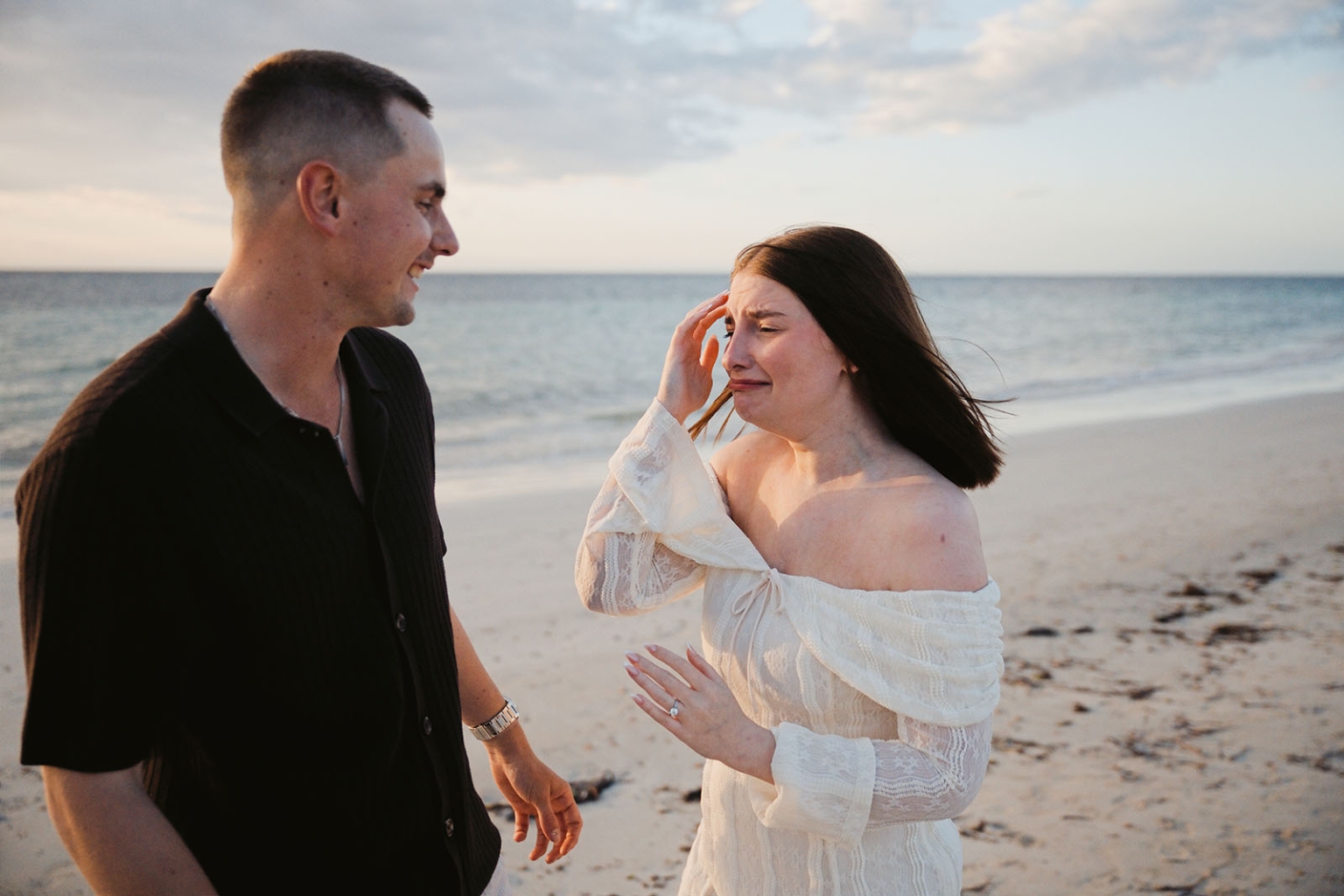 moonta's simms cove proposal – zoe & nathan 6 Zoe becomes emotional as Nathan smiles beside her on the beach at Simms Cove, Moonta.
