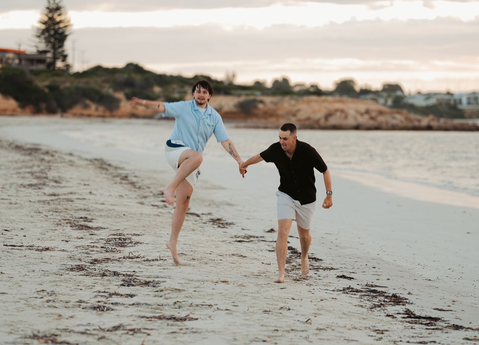 moonta's simms cove proposal – zoe & nathan 22 Zoe and Nathan holding hands and running barefoot along Simms Cove beach in Moonta